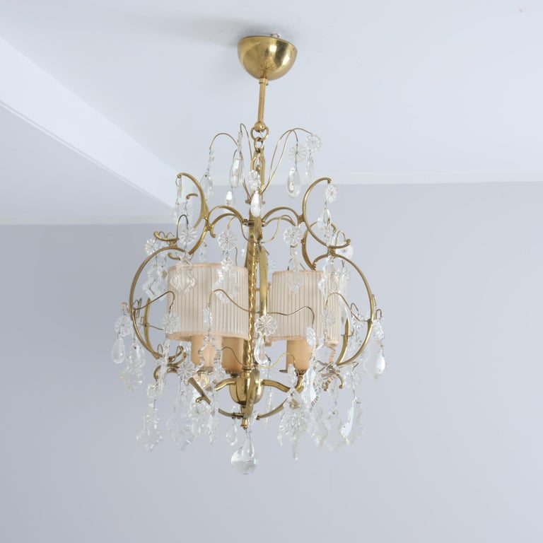 An Elegant Paavo Tynell Crystal & Brass Chandelier Model 1457-3
