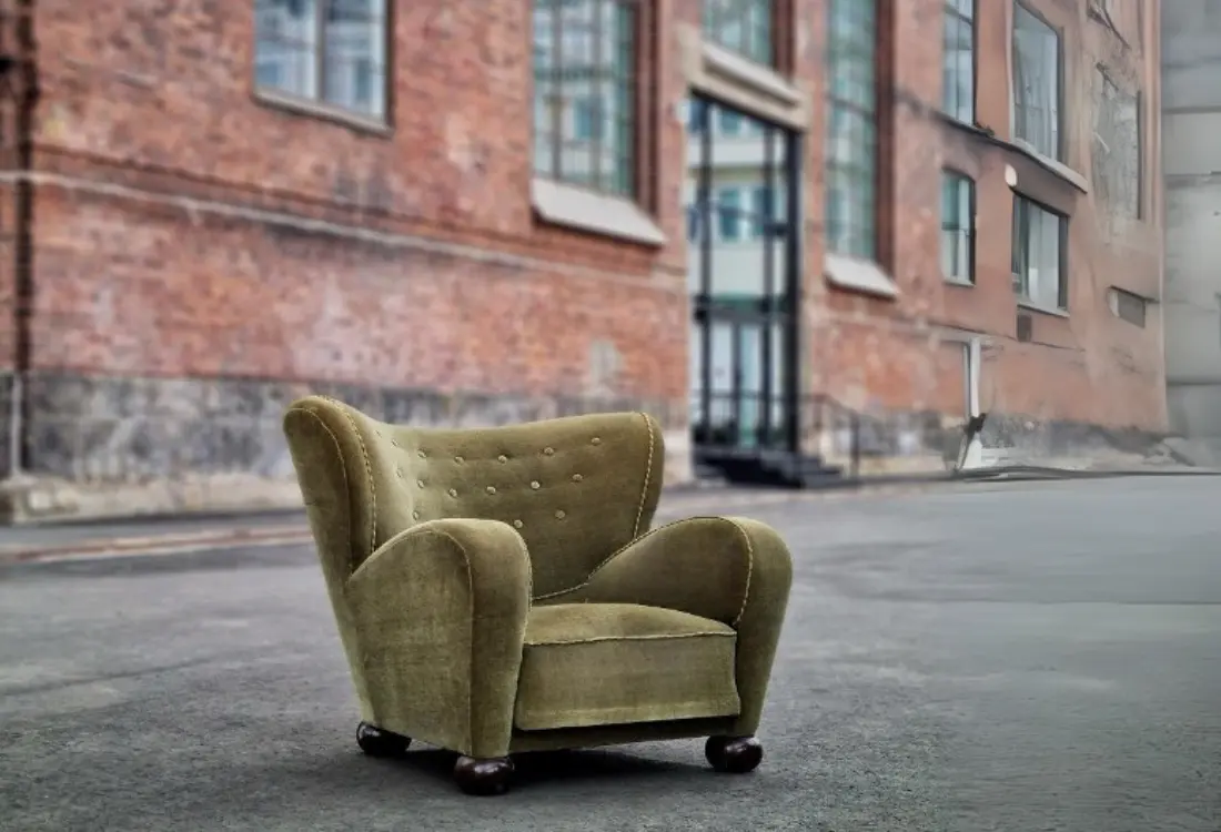 A green chair on the streetAI-generated content may be incorrect but look at those wonderful patterns and free space.