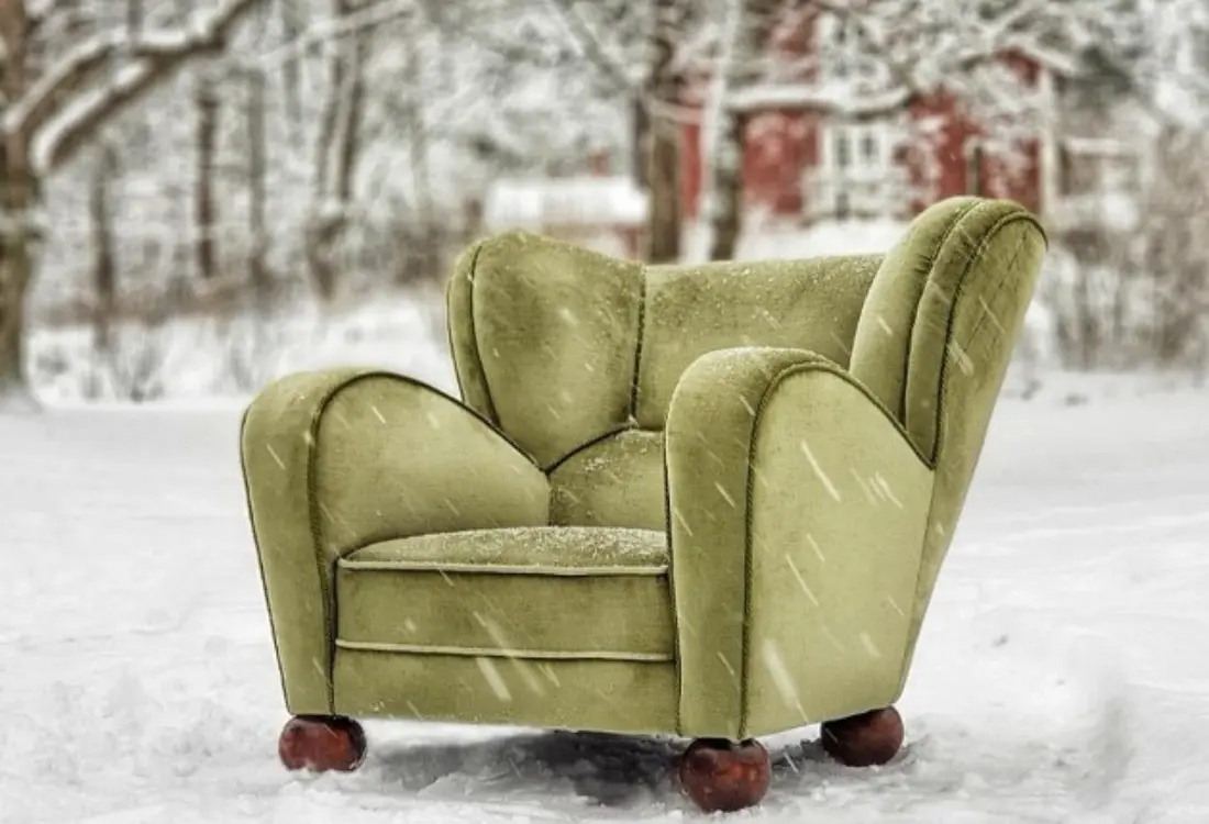 A green chair in the snow AI-generated content may be incorrect and the picture is enhanced.