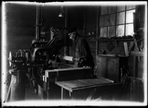 Historic furniture workshop with traditional woodworking machinery used in early Finnish design.