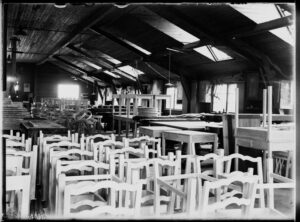 Historic furniture workshop of Nikolai Boman with handcrafted chairs, reflecting the early development of Finnish design.